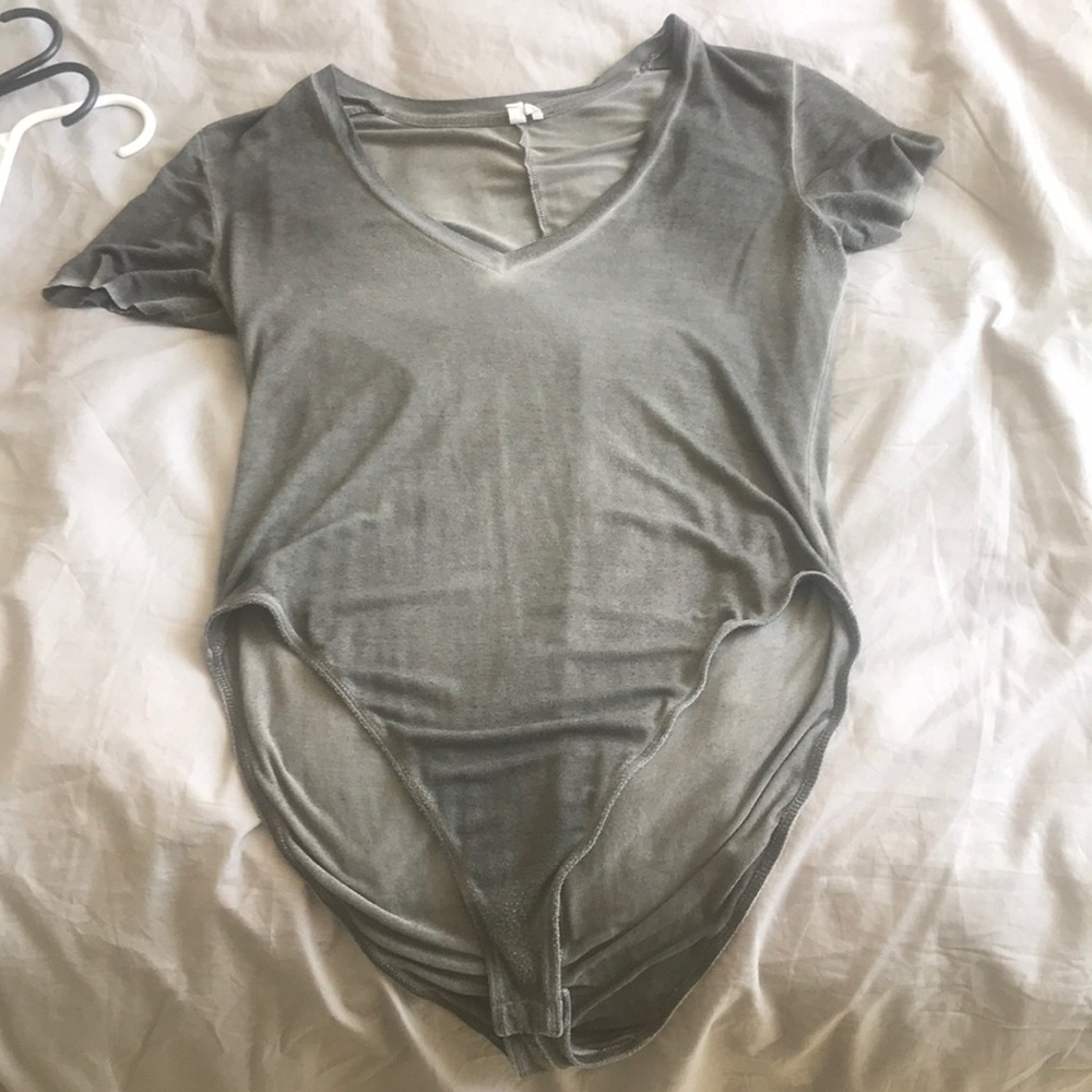 a gray low vneck body suit